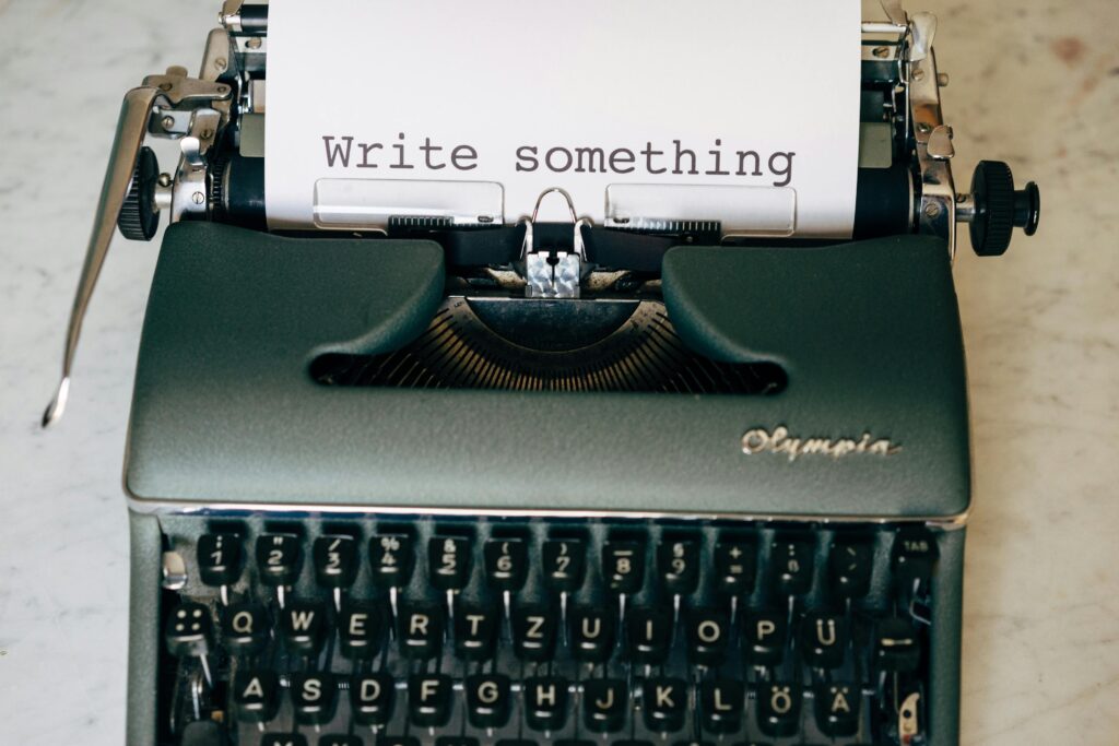 pexels-photo-4160144-4160144 Classic typewriter displaying 'Write something' on paper. Perfect for creative inspiration.
