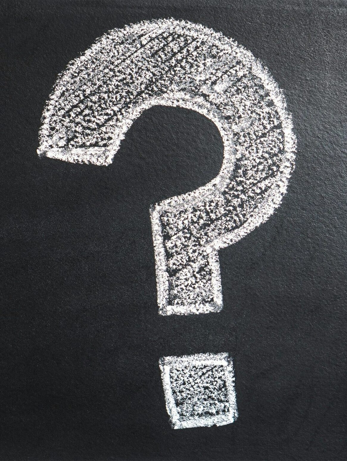 A conceptual image featuring a question mark drawn on a chalkboard, ideal for problem-solving contexts.