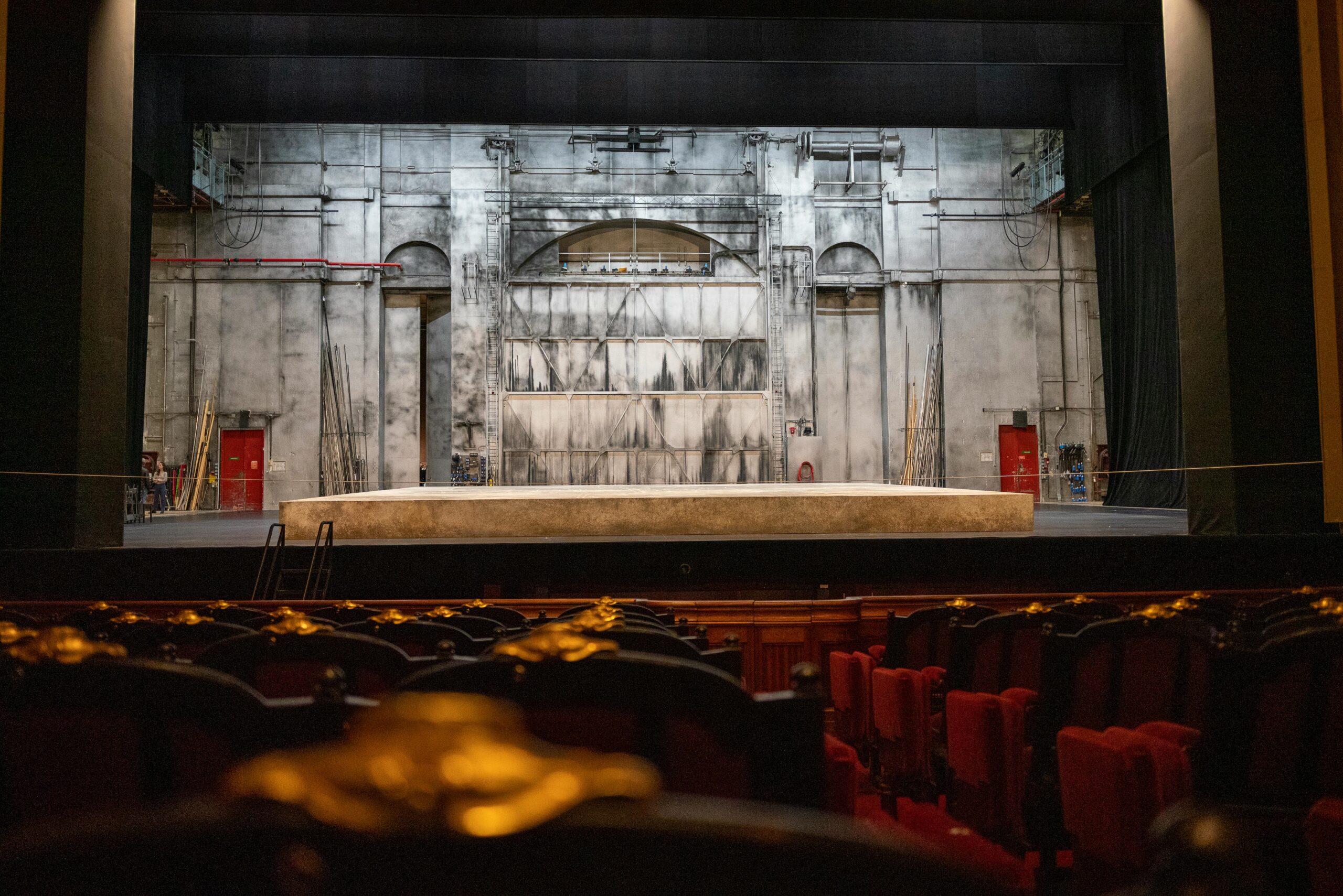 Empty theater stage with backdrop and seating in Paris, France.